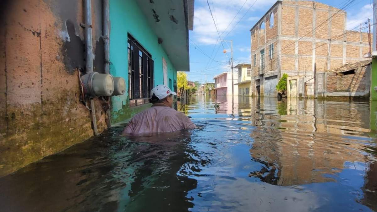 Calle del barrio de Santa Cecilia inundado tras el huracán John