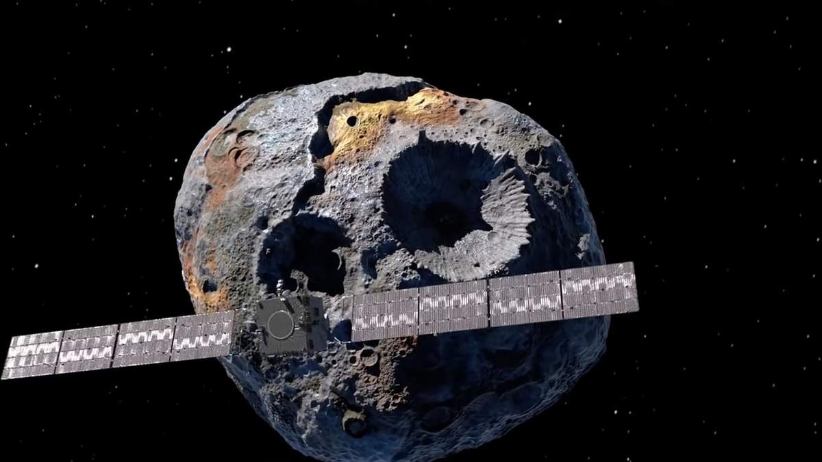 Representación de la misión Psyche frente al asteroide homónimo. Fuente: (Twitter)