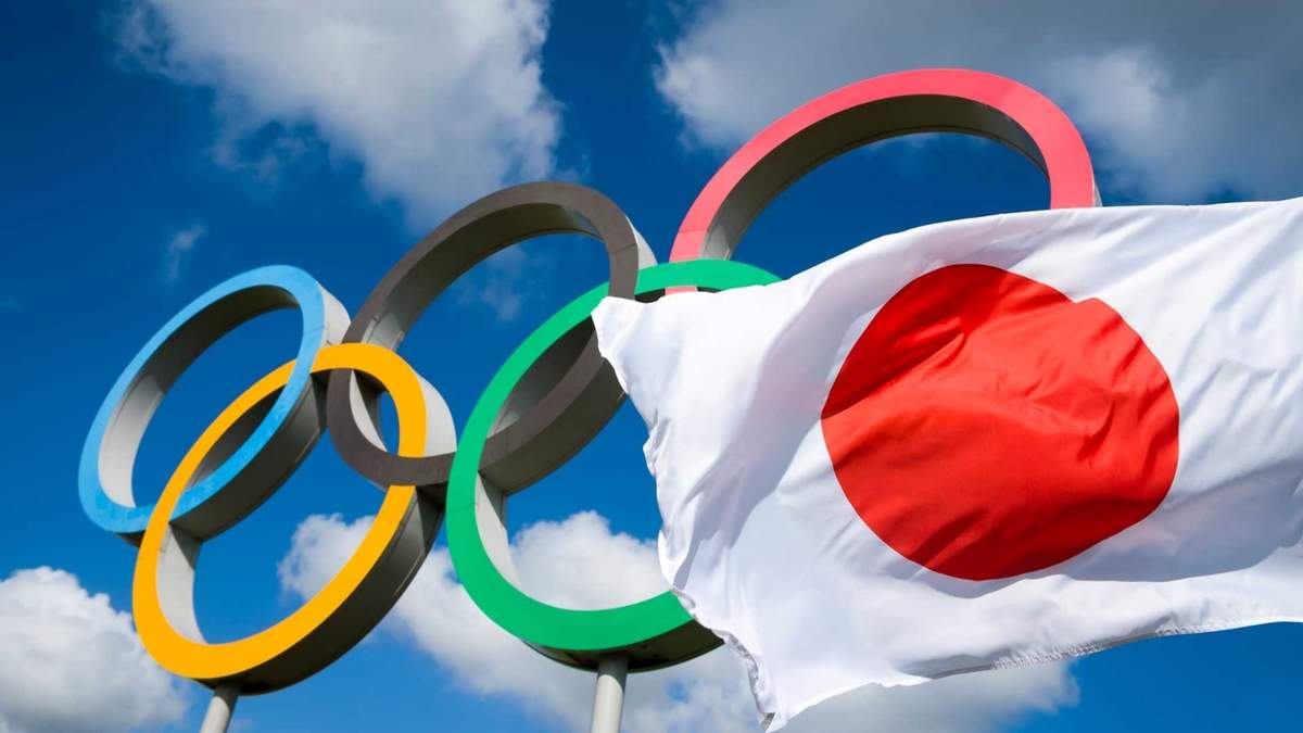 Bandera de Japón junto al emblema de los Juegos Olímpicos. Fuente: (Twitter)
