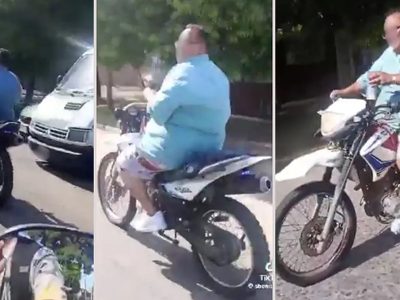 Escracharon a un inspector de tránsito que manejaba sin casco, sin patente y con una bebida en su mano
