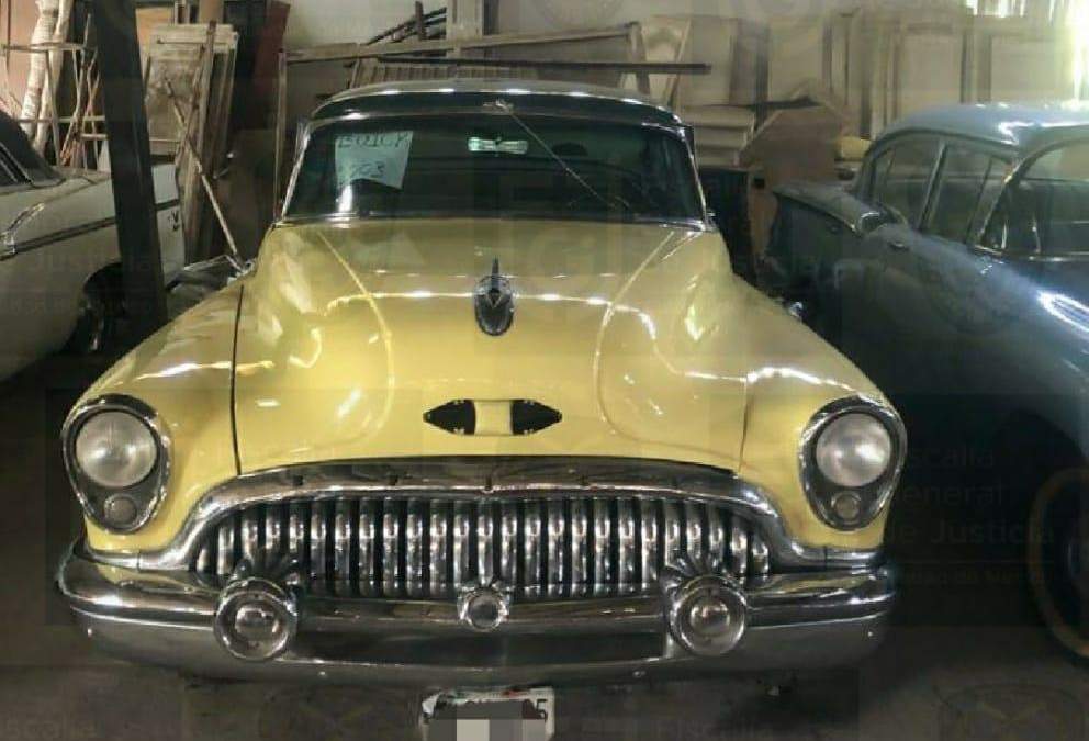 Los autos y arte decomisados en una casa de Raymundo Collins. Foto: FGJCDMX