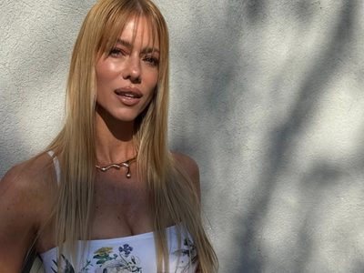 Un mix práctico y estiloso: Nicole Neumann y el combo de chaleco y botas que pisa fuerte en las calles