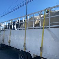 Rescatan en NL a centroamericanos escondidos en tinacos falsos