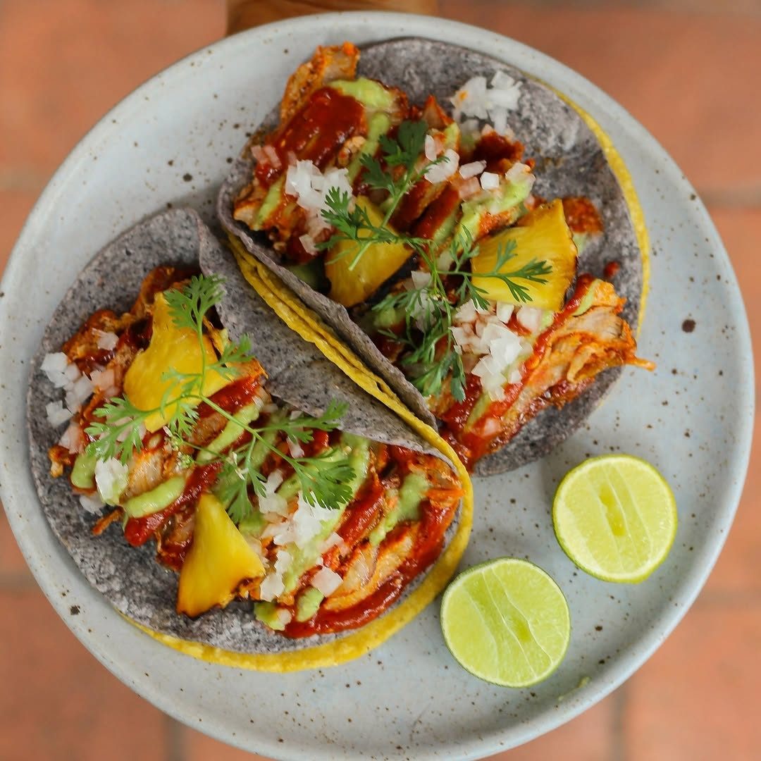 Al Pastor Tacos, served with salsa roja, verde, and roasted pineapple ??This is our special taco